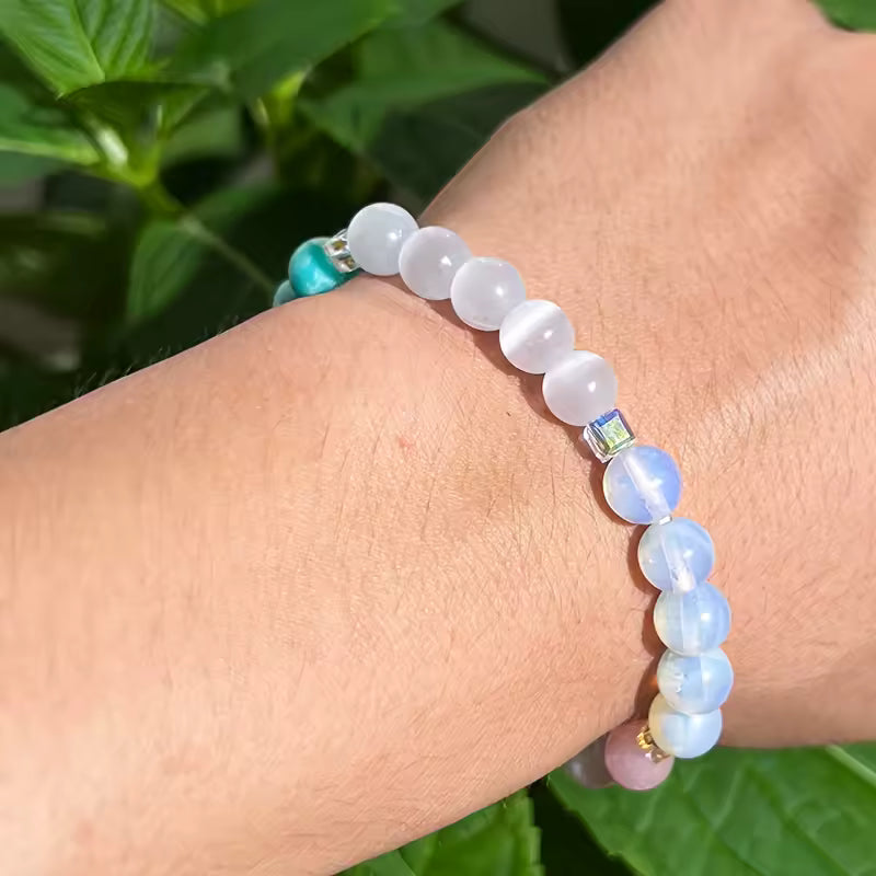 Women's healing energy bracelet with a variety of natural stones, opal, ocean stone, pink quartz, moonstone
