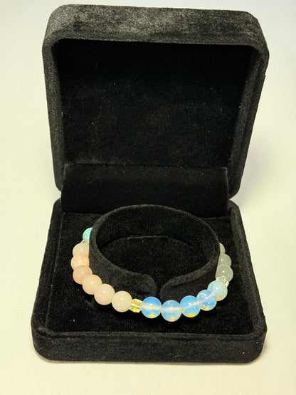 Women's healing energy bracelet with a variety of natural stones, opal, ocean stone, pink quartz, moonstone
