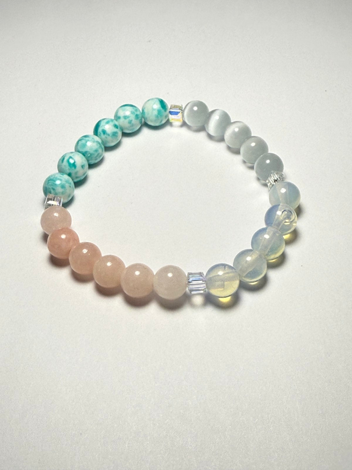 Women's healing energy bracelet with a variety of natural stones, opal, ocean stone, pink quartz, moonstone