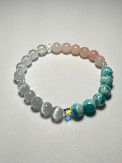 Women's healing energy bracelet with a variety of natural stones, opal, ocean stone, pink quartz, moonstone