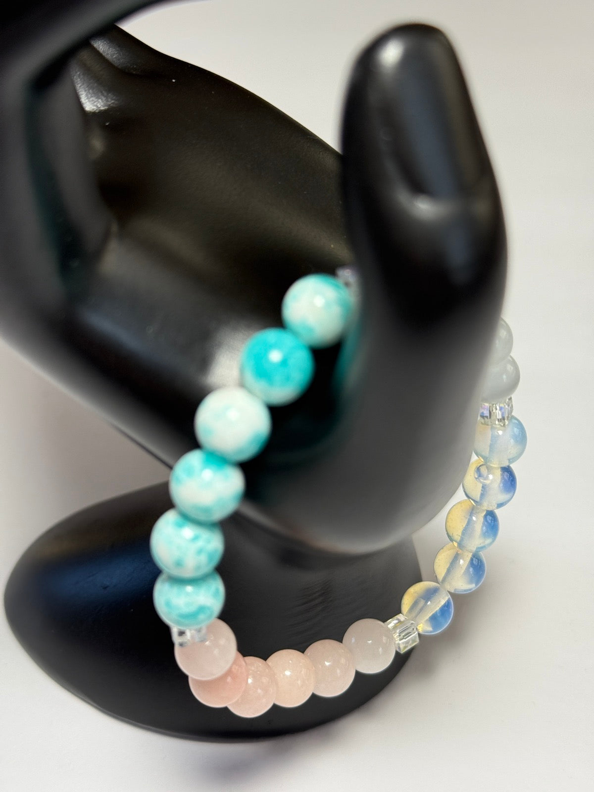 Women's healing energy bracelet with a variety of natural stones, opal, ocean stone, pink quartz, moonstone